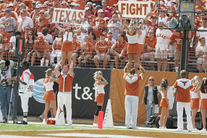 Texas Cheerleaders.  The University of Texas football team defeated the Arkansas Razorbacks with a score of 52-10 in Austin, TX on Saturday, September 27, 2008.

Filename: SRM_20080927_15381465.jpg
Aperture: f/5.6
Shutter Speed: 1/1000
Body: Canon EOS-1D Mark II
Lens: Canon EF 300mm f/2.8 L IS