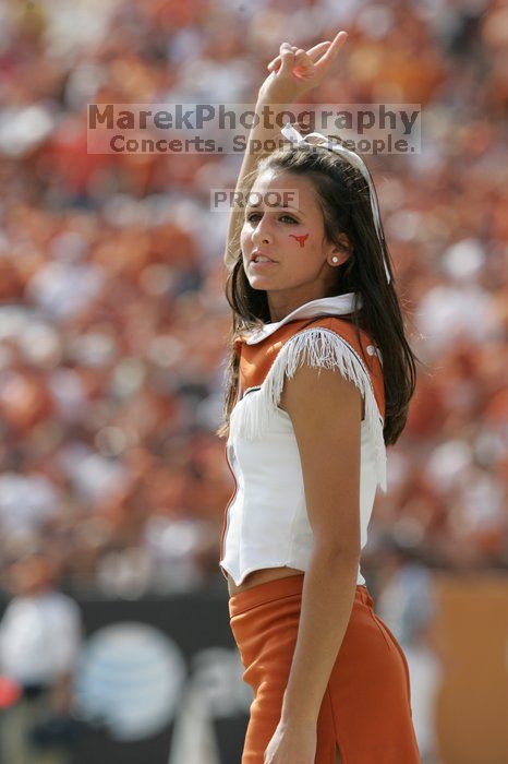 Texas Cheerleaders.  The University of Texas football team defeated the Arkansas Razorbacks with a score of 52-10 in Austin, TX on Saturday, September 27, 2008.

Filename: SRM_20080927_15401076.jpg
Aperture: f/5.6
Shutter Speed: 1/1250
Body: Canon EOS-1D Mark II
Lens: Canon EF 300mm f/2.8 L IS