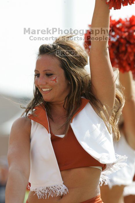 Texas Pom.  The University of Texas football team defeated the Arkansas Razorbacks with a score of 52-10 in Austin, TX on Saturday, September 27, 2008.

Filename: SRM_20080927_15405482.jpg
Aperture: f/5.6
Shutter Speed: 1/1000
Body: Canon EOS-1D Mark II
Lens: Canon EF 300mm f/2.8 L IS