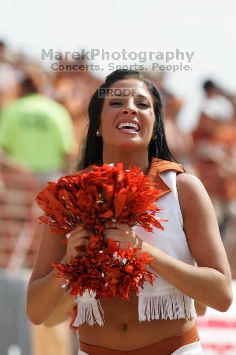 Texas Pom.  The University of Texas football team defeated the Arkansas Razorbacks with a score of 52-10 in Austin, TX on Saturday, September 27, 2008.

Filename: SRM_20080927_15414884.jpg
Aperture: f/5.6
Shutter Speed: 1/1250
Body: Canon EOS-1D Mark II
Lens: Canon EF 300mm f/2.8 L IS