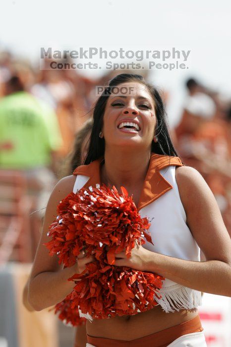 Texas Pom.  The University of Texas football team defeated the Arkansas Razorbacks with a score of 52-10 in Austin, TX on Saturday, September 27, 2008.

Filename: SRM_20080927_15414885.jpg
Aperture: f/5.6
Shutter Speed: 1/1250
Body: Canon EOS-1D Mark II
Lens: Canon EF 300mm f/2.8 L IS