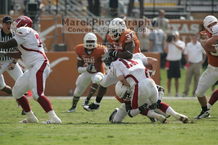 The University of Texas football team defeated the Arkansas Razorbacks with a score of 52-10 in Austin, TX on Saturday, September 27, 2008.

Filename: SRM_20080927_15461437.jpg
Aperture: f/5.6
Shutter Speed: 1/1250
Body: Canon EOS-1D Mark II
Lens: Canon EF 300mm f/2.8 L IS