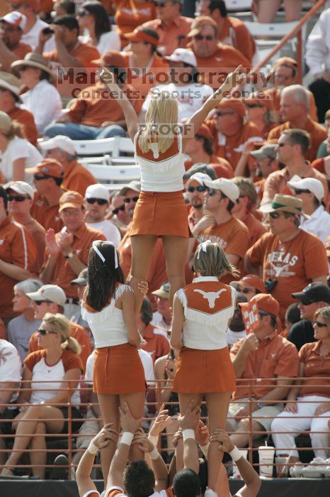 Texas Cheerleaders.  The University of Texas football team defeated the Arkansas Razorbacks with a score of 52-10 in Austin, TX on Saturday, September 27, 2008.

Filename: SRM_20080927_15480683.jpg
Aperture: f/5.6
Shutter Speed: 1/1000
Body: Canon EOS-1D Mark II
Lens: Canon EF 300mm f/2.8 L IS