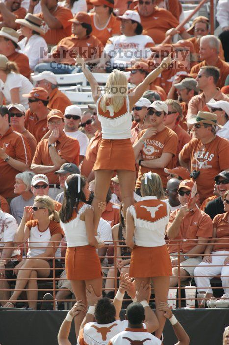 Texas Cheerleaders.  The University of Texas football team defeated the Arkansas Razorbacks with a score of 52-10 in Austin, TX on Saturday, September 27, 2008.

Filename: SRM_20080927_15480884.jpg
Aperture: f/5.6
Shutter Speed: 1/1000
Body: Canon EOS-1D Mark II
Lens: Canon EF 300mm f/2.8 L IS