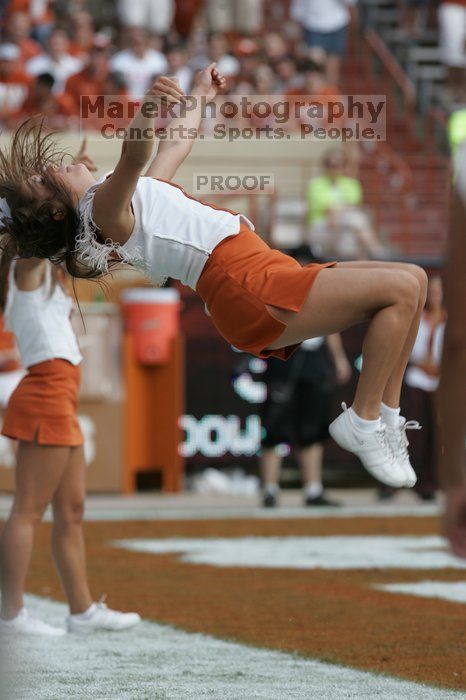 Texas Cheerleaders.  The University of Texas football team defeated the Arkansas Razorbacks with a score of 52-10 in Austin, TX on Saturday, September 27, 2008.

Filename: SRM_20080927_16012020.jpg
Aperture: f/5.6
Shutter Speed: 1/1000
Body: Canon EOS-1D Mark II
Lens: Canon EF 300mm f/2.8 L IS