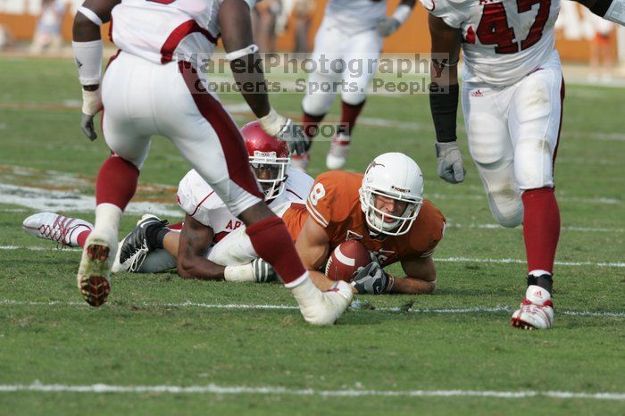 The University of Texas football team defeated the Arkansas Razorbacks with a score of 52-10 in Austin, TX on Saturday, September 27, 2008.

Filename: SRM_20080927_16450491.jpg
Aperture: f/5.6
Shutter Speed: 1/1000
Body: Canon EOS-1D Mark II
Lens: Canon EF 300mm f/2.8 L IS