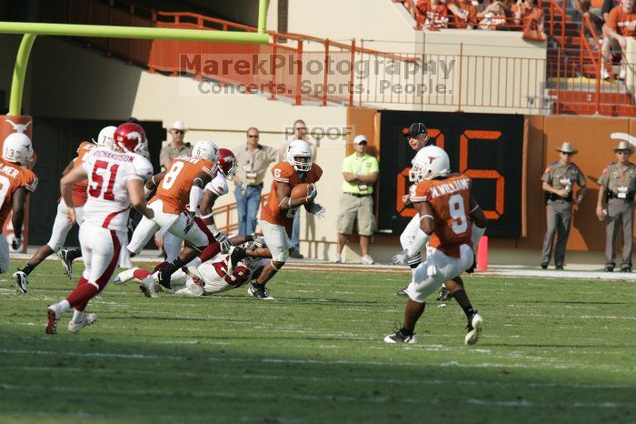 The University of Texas football team defeated the Arkansas Razorbacks with a score of 52-10 in Austin, TX on Saturday, September 27, 2008.

Filename: SRM_20080927_16535860.jpg
Aperture: f/5.6
Shutter Speed: 1/2000
Body: Canon EOS-1D Mark II
Lens: Canon EF 300mm f/2.8 L IS