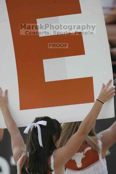 Texas Cheerleaders.  The University of Texas football team defeated the Arkansas Razorbacks with a score of 52-10 in Austin, TX on Saturday, September 27, 2008.

Filename: SRM_20080927_17101870.jpg
Aperture: f/5.6
Shutter Speed: 1/800
Body: Canon EOS-1D Mark II
Lens: Canon EF 300mm f/2.8 L IS