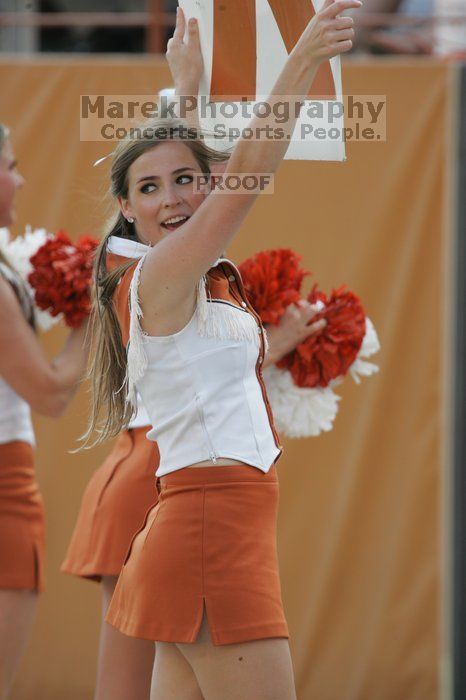 Texas Cheerleaders.  The University of Texas football team defeated the Arkansas Razorbacks with a score of 52-10 in Austin, TX on Saturday, September 27, 2008.

Filename: SRM_20080927_17102673.jpg
Aperture: f/5.6
Shutter Speed: 1/640
Body: Canon EOS-1D Mark II
Lens: Canon EF 300mm f/2.8 L IS