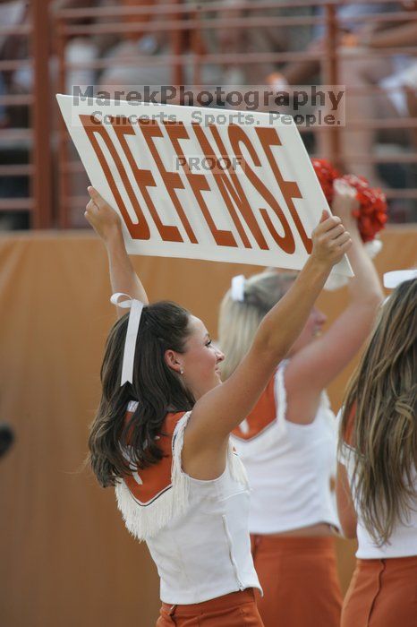 Texas Cheerleaders.  The University of Texas football team defeated the Arkansas Razorbacks with a score of 52-10 in Austin, TX on Saturday, September 27, 2008.

Filename: SRM_20080927_17123691.jpg
Aperture: f/5.6
Shutter Speed: 1/640
Body: Canon EOS-1D Mark II
Lens: Canon EF 300mm f/2.8 L IS