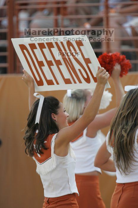 Texas Cheerleaders.  The University of Texas football team defeated the Arkansas Razorbacks with a score of 52-10 in Austin, TX on Saturday, September 27, 2008.

Filename: SRM_20080927_17123692.jpg
Aperture: f/5.6
Shutter Speed: 1/640
Body: Canon EOS-1D Mark II
Lens: Canon EF 300mm f/2.8 L IS