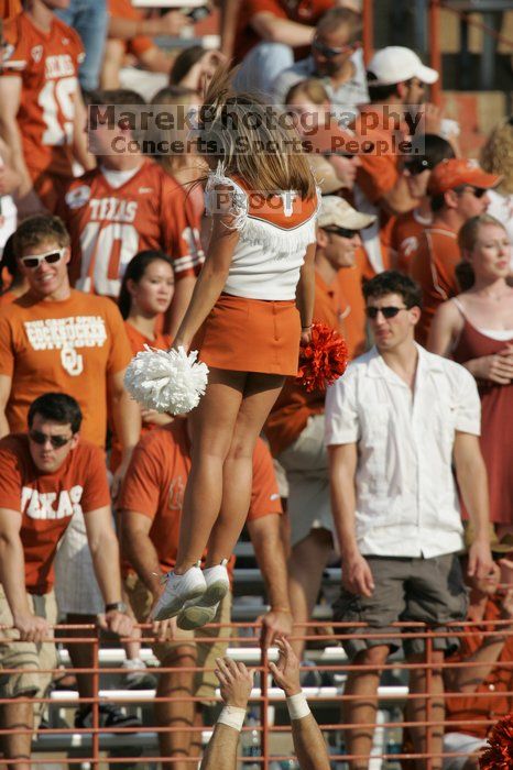 Texas Cheerleaders.  The University of Texas football team defeated the Arkansas Razorbacks with a score of 52-10 in Austin, TX on Saturday, September 27, 2008.

Filename: SRM_20080927_17132013.jpg
Aperture: f/5.6
Shutter Speed: 1/2500
Body: Canon EOS-1D Mark II
Lens: Canon EF 300mm f/2.8 L IS