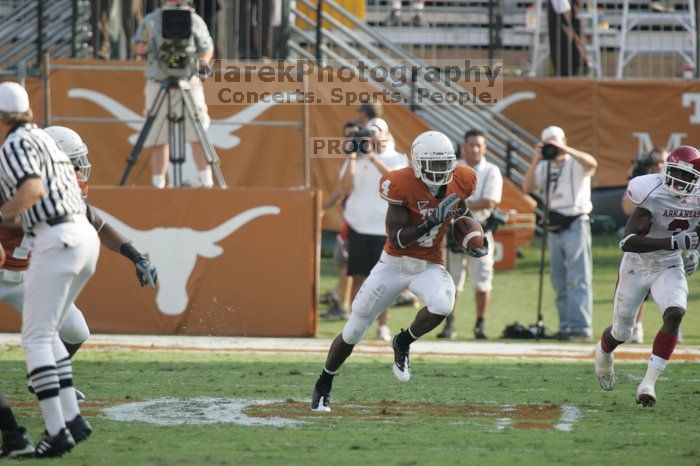 The University of Texas football team defeated the Arkansas Razorbacks with a score of 52-10 in Austin, TX on Saturday, September 27, 2008.

Filename: SRM_20080927_17161673.jpg
Aperture: f/5.6
Shutter Speed: 1/800
Body: Canon EOS-1D Mark II
Lens: Canon EF 300mm f/2.8 L IS