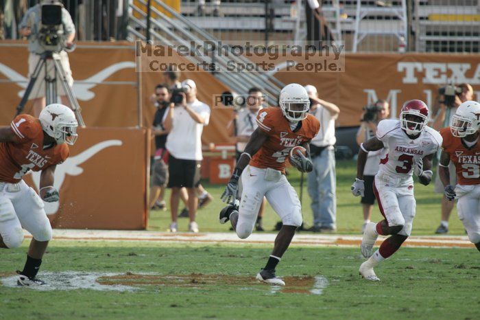 The University of Texas football team defeated the Arkansas Razorbacks with a score of 52-10 in Austin, TX on Saturday, September 27, 2008.

Filename: SRM_20080927_17161674.jpg
Aperture: f/5.6
Shutter Speed: 1/800
Body: Canon EOS-1D Mark II
Lens: Canon EF 300mm f/2.8 L IS