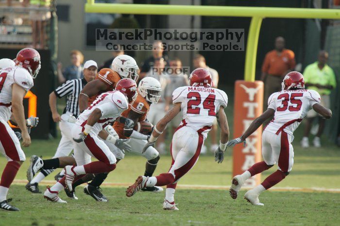 The University of Texas football team defeated the Arkansas Razorbacks with a score of 52-10 in Austin, TX on Saturday, September 27, 2008.

Filename: SRM_20080927_17382481.jpg
Aperture: f/5.6
Shutter Speed: 1/800
Body: Canon EOS-1D Mark II
Lens: Canon EF 300mm f/2.8 L IS