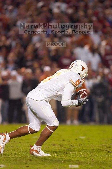 The University of Texas, Austin played Texas A&M in football at Kyle Field, College Station, on November 23, 2007.  UT lost to the Aggies, 30 to 38.

Filename: SRM_20071123_1832280.jpg
Aperture: f/2.8
Shutter Speed: 1/500
Body: Canon EOS-1D Mark II
Lens: Canon EF 300mm f/2.8 L IS