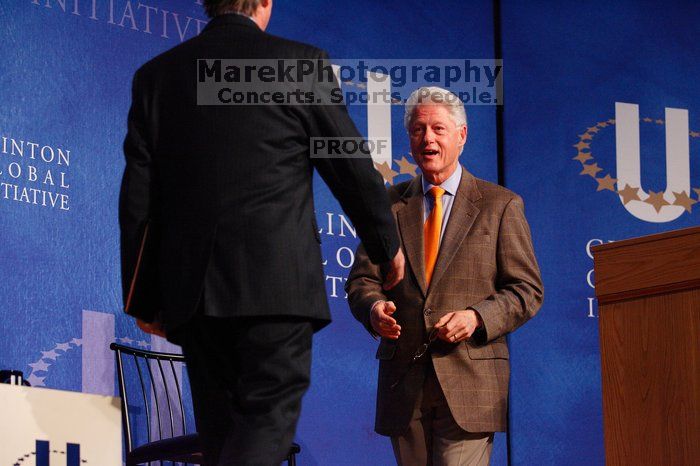 Former President Bill Clinton welcomes UT President William Powers Jr. to the stage.  Day one of the 2nd Annual Clinton Global Initiative University (CGIU) meeting was held at The University of Texas at Austin, Friday, February 13, 2009.

Filename: SRM_20090213_16292534.jpg
Aperture: f/4.0
Shutter Speed: 1/200
Body: Canon EOS-1D Mark II
Lens: Canon EF 80-200mm f/2.8 L