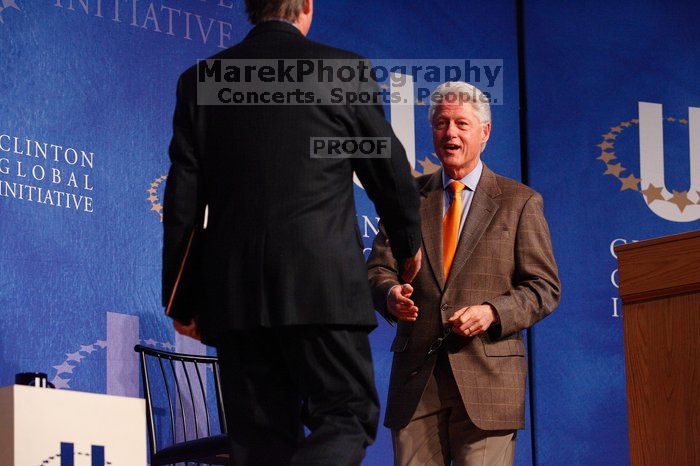 Former President Bill Clinton welcomes UT President William Powers Jr. to the stage.  Day one of the 2nd Annual Clinton Global Initiative University (CGIU) meeting was held at The University of Texas at Austin, Friday, February 13, 2009.

Filename: SRM_20090213_16292535.jpg
Aperture: f/4.0
Shutter Speed: 1/200
Body: Canon EOS-1D Mark II
Lens: Canon EF 80-200mm f/2.8 L