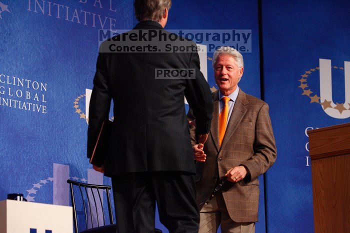 Former President Bill Clinton welcomes UT President William Powers Jr. to the stage.  Day one of the 2nd Annual Clinton Global Initiative University (CGIU) meeting was held at The University of Texas at Austin, Friday, February 13, 2009.

Filename: SRM_20090213_16292536.jpg
Aperture: f/4.0
Shutter Speed: 1/200
Body: Canon EOS-1D Mark II
Lens: Canon EF 80-200mm f/2.8 L