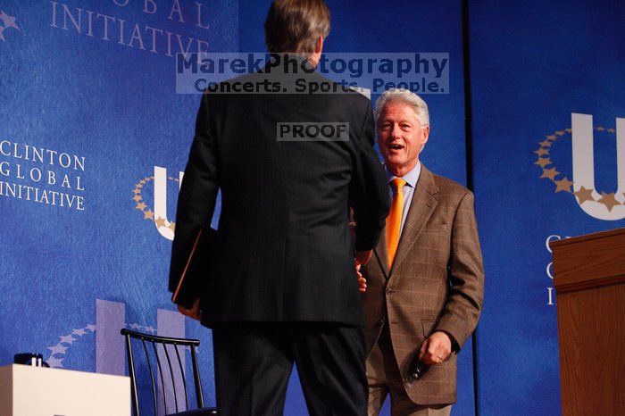 Former President Bill Clinton welcomes UT President William Powers Jr. to the stage.  Day one of the 2nd Annual Clinton Global Initiative University (CGIU) meeting was held at The University of Texas at Austin, Friday, February 13, 2009.

Filename: SRM_20090213_16292537.jpg
Aperture: f/4.0
Shutter Speed: 1/200
Body: Canon EOS-1D Mark II
Lens: Canon EF 80-200mm f/2.8 L