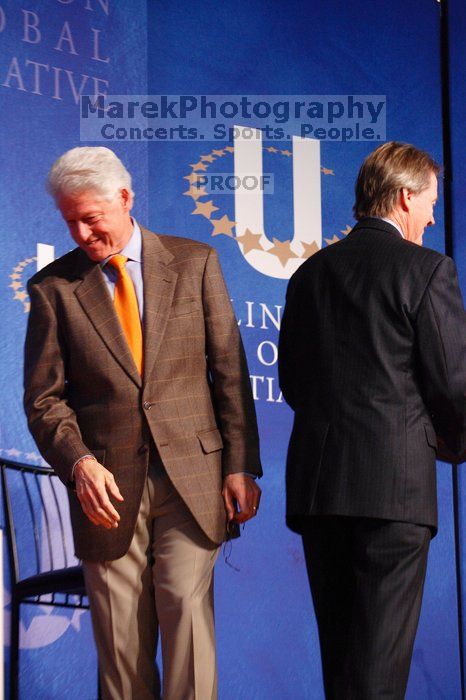 Former President Bill Clinton welcomes UT President William Powers Jr. to the stage.  Day one of the 2nd Annual Clinton Global Initiative University (CGIU) meeting was held at The University of Texas at Austin, Friday, February 13, 2009.

Filename: SRM_20090213_16293244.jpg
Aperture: f/4.0
Shutter Speed: 1/125
Body: Canon EOS-1D Mark II
Lens: Canon EF 80-200mm f/2.8 L