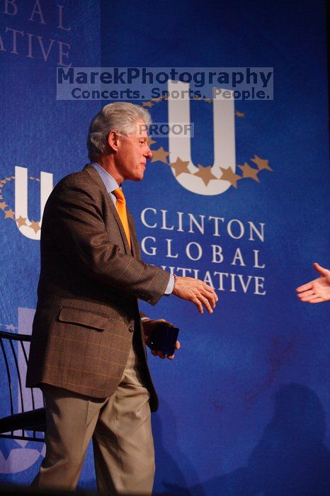 Former President Bill Clinton shakes hands with UT President William Powers Jr. after he spoke at the opening plenary session of the CGIU meeting.  Day one of the 2nd Annual Clinton Global Initiative University (CGIU) meeting was held at The University of Texas at Austin, Friday, February 13, 2009.

Filename: SRM_20090213_16354000.jpg
Aperture: f/4.0
Shutter Speed: 1/200
Body: Canon EOS-1D Mark II
Lens: Canon EF 80-200mm f/2.8 L