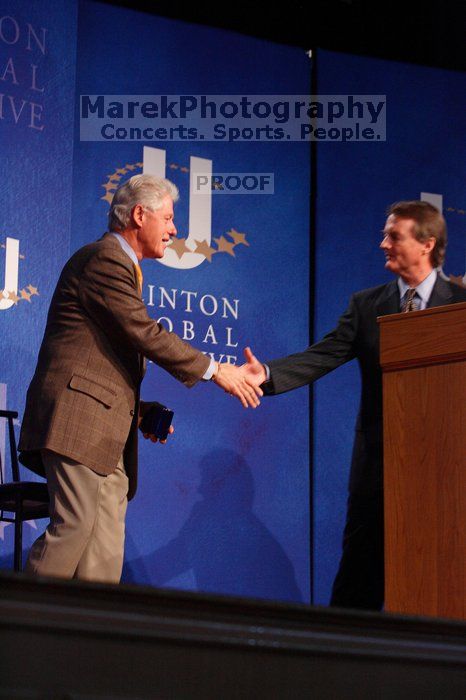 Former President Bill Clinton shakes hands with UT President William Powers Jr. after he spoke at the opening plenary session of the CGIU meeting.  Day one of the 2nd Annual Clinton Global Initiative University (CGIU) meeting was held at The University of Texas at Austin, Friday, February 13, 2009.

Filename: SRM_20090213_16354101.jpg
Aperture: f/4.0
Shutter Speed: 1/160
Body: Canon EOS-1D Mark II
Lens: Canon EF 80-200mm f/2.8 L