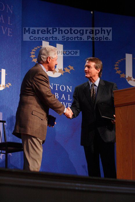 Former President Bill Clinton shakes hands with UT President William Powers Jr. after he spoke at the opening plenary session of the CGIU meeting.  Day one of the 2nd Annual Clinton Global Initiative University (CGIU) meeting was held at The University of Texas at Austin, Friday, February 13, 2009.

Filename: SRM_20090213_16354106.jpg
Aperture: f/4.0
Shutter Speed: 1/160
Body: Canon EOS-1D Mark II
Lens: Canon EF 80-200mm f/2.8 L