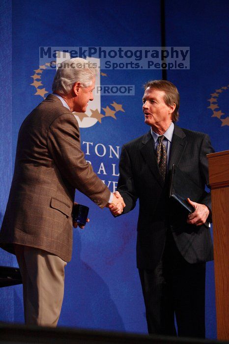 Former President Bill Clinton shakes hands with UT President William Powers Jr. after he spoke at the opening plenary session of the CGIU meeting.  Day one of the 2nd Annual Clinton Global Initiative University (CGIU) meeting was held at The University of Texas at Austin, Friday, February 13, 2009.

Filename: SRM_20090213_16354209.jpg
Aperture: f/4.0
Shutter Speed: 1/160
Body: Canon EOS-1D Mark II
Lens: Canon EF 80-200mm f/2.8 L