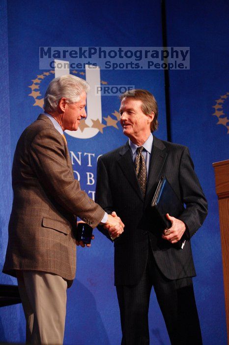 Former President Bill Clinton shakes hands with UT President William Powers Jr. after he spoke at the opening plenary session of the CGIU meeting.  Day one of the 2nd Annual Clinton Global Initiative University (CGIU) meeting was held at The University of Texas at Austin, Friday, February 13, 2009.

Filename: SRM_20090213_16354211.jpg
Aperture: f/4.0
Shutter Speed: 1/125
Body: Canon EOS-1D Mark II
Lens: Canon EF 80-200mm f/2.8 L