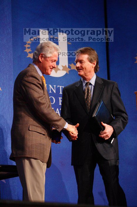 Former President Bill Clinton shakes hands with UT President William Powers Jr. after he spoke at the opening plenary session of the CGIU meeting.  Day one of the 2nd Annual Clinton Global Initiative University (CGIU) meeting was held at The University of Texas at Austin, Friday, February 13, 2009.

Filename: SRM_20090213_16354212.jpg
Aperture: f/4.0
Shutter Speed: 1/125
Body: Canon EOS-1D Mark II
Lens: Canon EF 80-200mm f/2.8 L