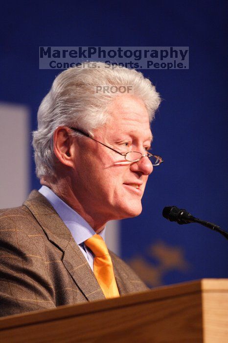 Former President Bill Clinton hands out commitment certificates to CGIU attendees for their exceptional pledges to the CGI cause during the opening plenary session of the CGIU meeting.  Day one of the 2nd Annual Clinton Global Initiative University (CGIU) meeting was held at The University of Texas at Austin, Friday, February 13, 2009.

Filename: SRM_20090213_16363661.jpg
Aperture: f/2.8
Shutter Speed: 1/200
Body: Canon EOS 20D
Lens: Canon EF 300mm f/2.8 L IS