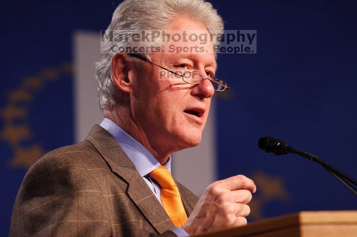 Former President Bill Clinton hands out commitment certificates to CGIU attendees for their exceptional pledges to the CGI cause during the opening plenary session of the CGIU meeting.  Day one of the 2nd Annual Clinton Global Initiative University (CGIU) meeting was held at The University of Texas at Austin, Friday, February 13, 2009.

Filename: SRM_20090213_16364764.jpg
Aperture: f/2.8
Shutter Speed: 1/250
Body: Canon EOS 20D
Lens: Canon EF 300mm f/2.8 L IS