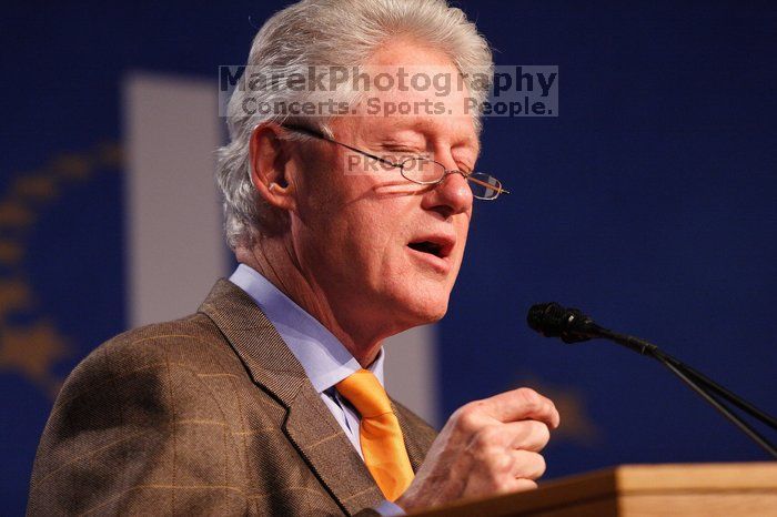 Former President Bill Clinton hands out commitment certificates to CGIU attendees for their exceptional pledges to the CGI cause during the opening plenary session of the CGIU meeting.  Day one of the 2nd Annual Clinton Global Initiative University (CGIU) meeting was held at The University of Texas at Austin, Friday, February 13, 2009.

Filename: SRM_20090213_16364865.jpg
Aperture: f/2.8
Shutter Speed: 1/250
Body: Canon EOS 20D
Lens: Canon EF 300mm f/2.8 L IS