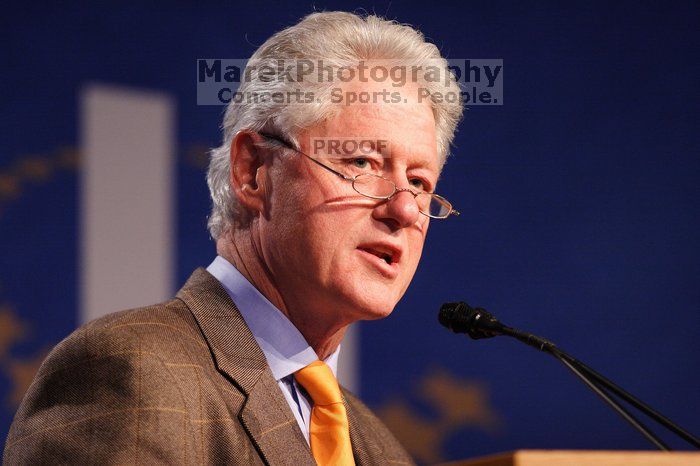 Former President Bill Clinton hands out commitment certificates to CGIU attendees for their exceptional pledges to the CGI cause during the opening plenary session of the CGIU meeting.  Day one of the 2nd Annual Clinton Global Initiative University (CGIU) meeting was held at The University of Texas at Austin, Friday, February 13, 2009.

Filename: SRM_20090213_16365967.jpg
Aperture: f/2.8
Shutter Speed: 1/200
Body: Canon EOS 20D
Lens: Canon EF 300mm f/2.8 L IS