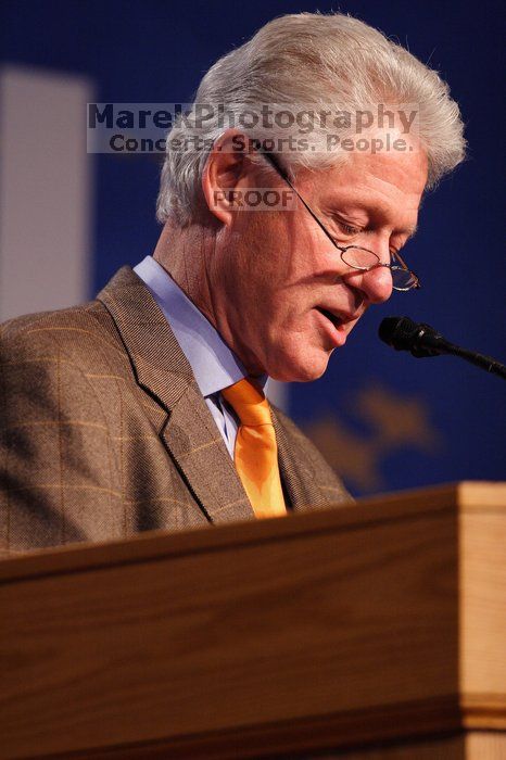 Former President Bill Clinton hands out commitment certificates to CGIU attendees for their exceptional pledges to the CGI cause during the opening plenary session of the CGIU meeting.  Day one of the 2nd Annual Clinton Global Initiative University (CGIU) meeting was held at The University of Texas at Austin, Friday, February 13, 2009.

Filename: SRM_20090213_16370969.jpg
Aperture: f/2.8
Shutter Speed: 1/250
Body: Canon EOS 20D
Lens: Canon EF 300mm f/2.8 L IS