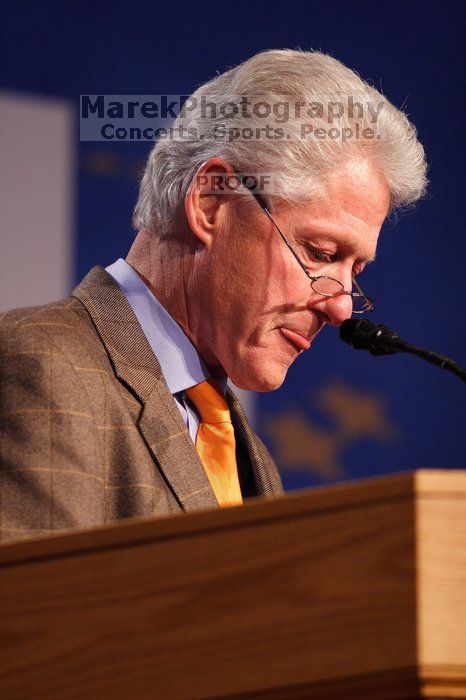 Former President Bill Clinton hands out commitment certificates to CGIU attendees for their exceptional pledges to the CGI cause during the opening plenary session of the CGIU meeting.  Day one of the 2nd Annual Clinton Global Initiative University (CGIU) meeting was held at The University of Texas at Austin, Friday, February 13, 2009.

Filename: SRM_20090213_16371270.jpg
Aperture: f/2.8
Shutter Speed: 1/200
Body: Canon EOS 20D
Lens: Canon EF 300mm f/2.8 L IS