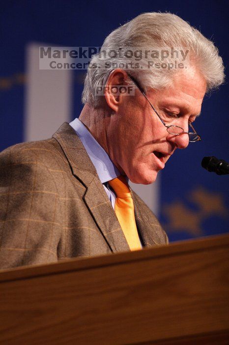 Former President Bill Clinton hands out commitment certificates to CGIU attendees for their exceptional pledges to the CGI cause during the opening plenary session of the CGIU meeting.  Day one of the 2nd Annual Clinton Global Initiative University (CGIU) meeting was held at The University of Texas at Austin, Friday, February 13, 2009.

Filename: SRM_20090213_16371571.jpg
Aperture: f/2.8
Shutter Speed: 1/200
Body: Canon EOS 20D
Lens: Canon EF 300mm f/2.8 L IS