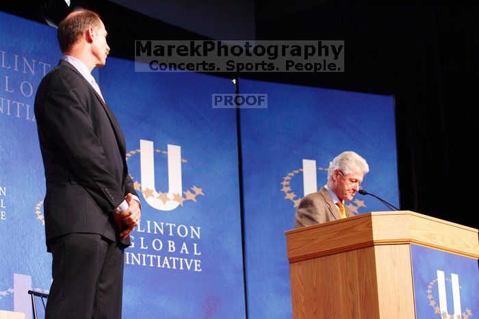 Former President Bill Clinton hands out commitment certificates to CGIU attendees for their exceptional pledges to the CGI cause during the opening plenary session of the CGIU meeting.  Day one of the 2nd Annual Clinton Global Initiative University (CGIU) meeting was held at The University of Texas at Austin, Friday, February 13, 2009.

Filename: SRM_20090213_16372917.jpg
Aperture: f/4.0
Shutter Speed: 1/80
Body: Canon EOS-1D Mark II
Lens: Canon EF 80-200mm f/2.8 L