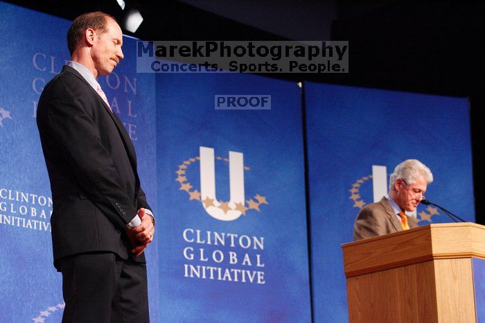 Former President Bill Clinton hands out commitment certificates to CGIU attendees for their exceptional pledges to the CGI cause during the opening plenary session of the CGIU meeting.  Day one of the 2nd Annual Clinton Global Initiative University (CGIU) meeting was held at The University of Texas at Austin, Friday, February 13, 2009.

Filename: SRM_20090213_16374421.jpg
Aperture: f/4.0
Shutter Speed: 1/125
Body: Canon EOS-1D Mark II
Lens: Canon EF 80-200mm f/2.8 L