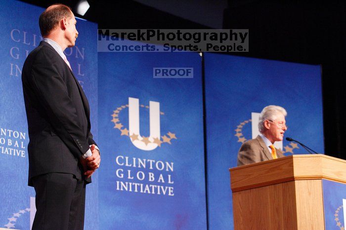 Former President Bill Clinton hands out commitment certificates to CGIU attendees for their exceptional pledges to the CGI cause during the opening plenary session of the CGIU meeting.  Day one of the 2nd Annual Clinton Global Initiative University (CGIU) meeting was held at The University of Texas at Austin, Friday, February 13, 2009.

Filename: SRM_20090213_16375122.jpg
Aperture: f/4.0
Shutter Speed: 1/100
Body: Canon EOS-1D Mark II
Lens: Canon EF 80-200mm f/2.8 L