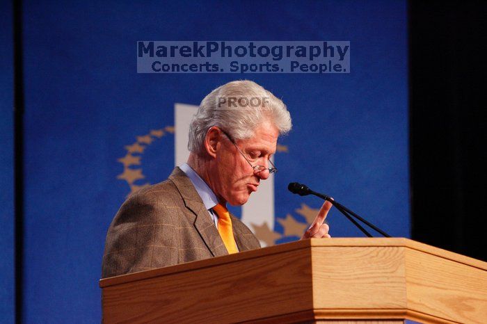 Former President Bill Clinton hands out commitment certificates to CGIU attendees for their exceptional pledges to the CGI cause during the opening plenary session of the CGIU meeting.  Day one of the 2nd Annual Clinton Global Initiative University (CGIU) meeting was held at The University of Texas at Austin, Friday, February 13, 2009.

Filename: SRM_20090213_16385428.jpg
Aperture: f/4.0
Shutter Speed: 1/160
Body: Canon EOS-1D Mark II
Lens: Canon EF 80-200mm f/2.8 L