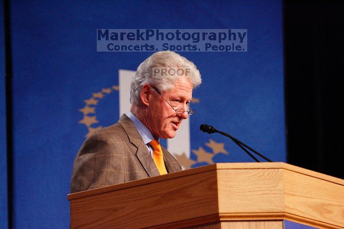 Former President Bill Clinton hands out commitment certificates to CGIU attendees for their exceptional pledges to the CGI cause during the opening plenary session of the CGIU meeting.  Day one of the 2nd Annual Clinton Global Initiative University (CGIU) meeting was held at The University of Texas at Austin, Friday, February 13, 2009.

Filename: SRM_20090213_16385630.jpg
Aperture: f/4.0
Shutter Speed: 1/160
Body: Canon EOS-1D Mark II
Lens: Canon EF 80-200mm f/2.8 L