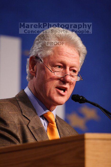 Former President Bill Clinton hands out commitment certificates to CGIU attendees for their exceptional pledges to the CGI cause during the opening plenary session of the CGIU meeting.  Day one of the 2nd Annual Clinton Global Initiative University (CGIU) meeting was held at The University of Texas at Austin, Friday, February 13, 2009.

Filename: SRM_20090213_16393473.jpg
Aperture: f/2.8
Shutter Speed: 1/320
Body: Canon EOS 20D
Lens: Canon EF 300mm f/2.8 L IS