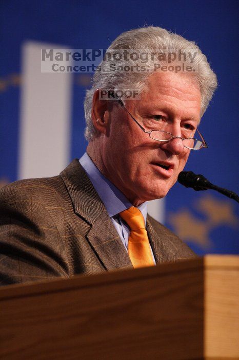 Former President Bill Clinton hands out commitment certificates to CGIU attendees for their exceptional pledges to the CGI cause during the opening plenary session of the CGIU meeting.  Day one of the 2nd Annual Clinton Global Initiative University (CGIU) meeting was held at The University of Texas at Austin, Friday, February 13, 2009.

Filename: SRM_20090213_16393875.jpg
Aperture: f/2.8
Shutter Speed: 1/320
Body: Canon EOS 20D
Lens: Canon EF 300mm f/2.8 L IS