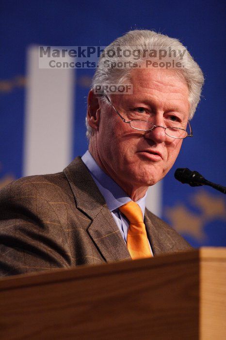 Former President Bill Clinton hands out commitment certificates to CGIU attendees for their exceptional pledges to the CGI cause during the opening plenary session of the CGIU meeting.  Day one of the 2nd Annual Clinton Global Initiative University (CGIU) meeting was held at The University of Texas at Austin, Friday, February 13, 2009.

Filename: SRM_20090213_16393977.jpg
Aperture: f/2.8
Shutter Speed: 1/320
Body: Canon EOS 20D
Lens: Canon EF 300mm f/2.8 L IS