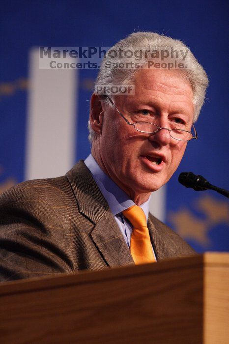 Former President Bill Clinton hands out commitment certificates to CGIU attendees for their exceptional pledges to the CGI cause during the opening plenary session of the CGIU meeting.  Day one of the 2nd Annual Clinton Global Initiative University (CGIU) meeting was held at The University of Texas at Austin, Friday, February 13, 2009.

Filename: SRM_20090213_16394078.jpg
Aperture: f/2.8
Shutter Speed: 1/320
Body: Canon EOS 20D
Lens: Canon EF 300mm f/2.8 L IS