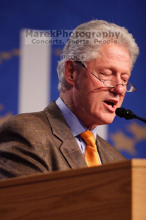 Former President Bill Clinton hands out commitment certificates to CGIU attendees for their exceptional pledges to the CGI cause during the opening plenary session of the CGIU meeting.  Day one of the 2nd Annual Clinton Global Initiative University (CGIU) meeting was held at The University of Texas at Austin, Friday, February 13, 2009.

Filename: SRM_20090213_16394479.jpg
Aperture: f/2.8
Shutter Speed: 1/250
Body: Canon EOS 20D
Lens: Canon EF 300mm f/2.8 L IS