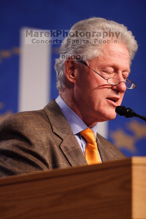 Former President Bill Clinton hands out commitment certificates to CGIU attendees for their exceptional pledges to the CGI cause during the opening plenary session of the CGIU meeting.  Day one of the 2nd Annual Clinton Global Initiative University (CGIU) meeting was held at The University of Texas at Austin, Friday, February 13, 2009.

Filename: SRM_20090213_16394480.jpg
Aperture: f/2.8
Shutter Speed: 1/250
Body: Canon EOS 20D
Lens: Canon EF 300mm f/2.8 L IS