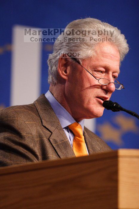 Former President Bill Clinton hands out commitment certificates to CGIU attendees for their exceptional pledges to the CGI cause during the opening plenary session of the CGIU meeting.  Day one of the 2nd Annual Clinton Global Initiative University (CGIU) meeting was held at The University of Texas at Austin, Friday, February 13, 2009.

Filename: SRM_20090213_16394581.jpg
Aperture: f/2.8
Shutter Speed: 1/250
Body: Canon EOS 20D
Lens: Canon EF 300mm f/2.8 L IS